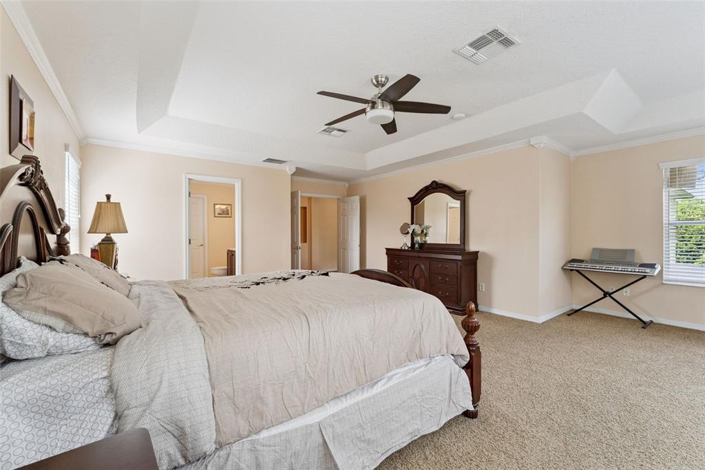 14790 Tullamore Loop Winter Garden, FL 34787 - Photo 22 of 42 a bedroom with a bed and a view of living room