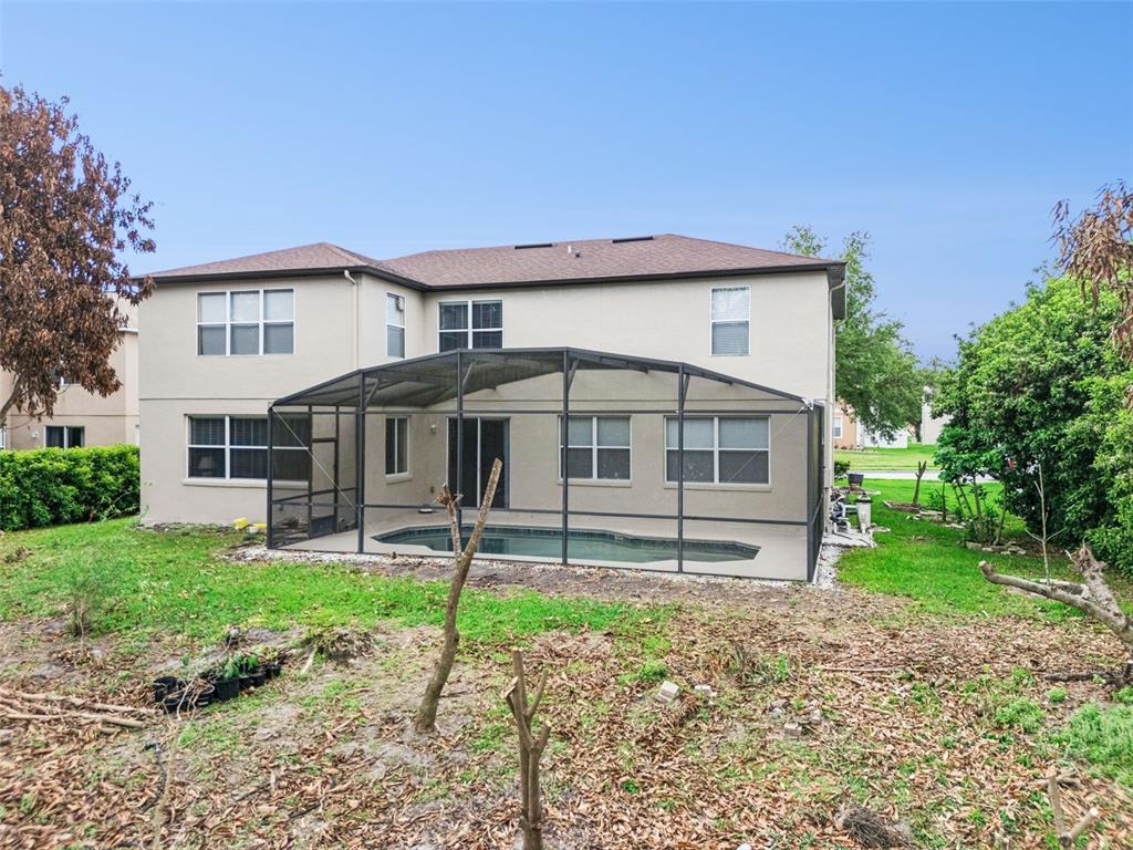 14790 Tullamore Loop Winter Garden, FL 34787 - Photo 36 of 42 a front view of a house with a garden and plants