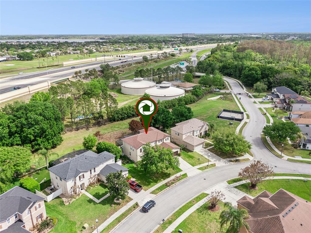 14790 Tullamore Loop Winter Garden, FL 34787 - Photo 40 of 42 an aerial view of a city with lots of residential buildings and mountain view in back