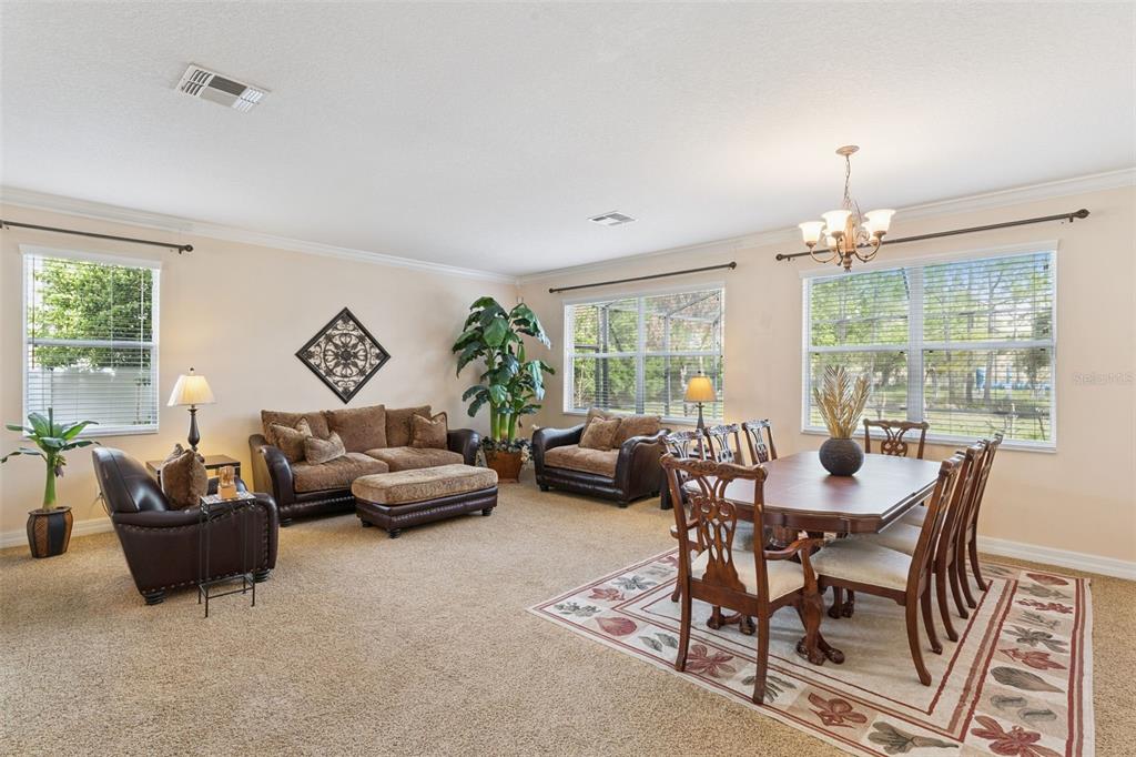 14790 Tullamore Loop Winter Garden, FL 34787 - Photo 4 of 42 a livingroom with furniture a livingroom and chandelier