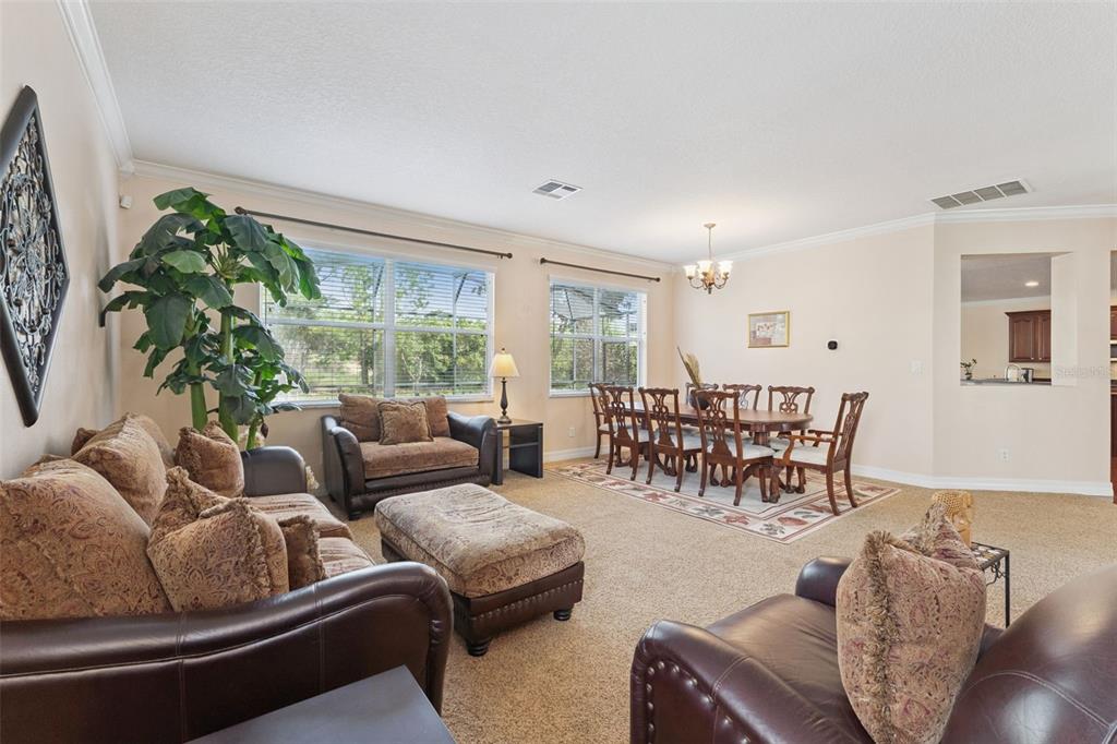 14790 Tullamore Loop Winter Garden, FL 34787 - Photo 5 of 42 a living room with furniture and a large window