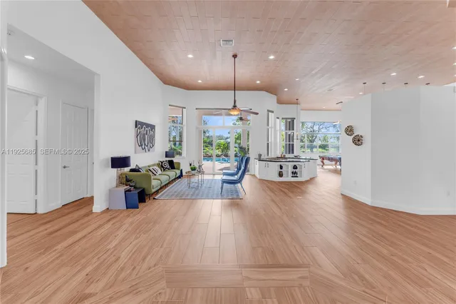 a view of a room with wooden floor
