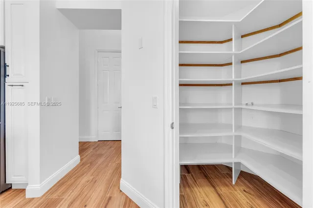 a bathroom with a sink and mirror with toilet