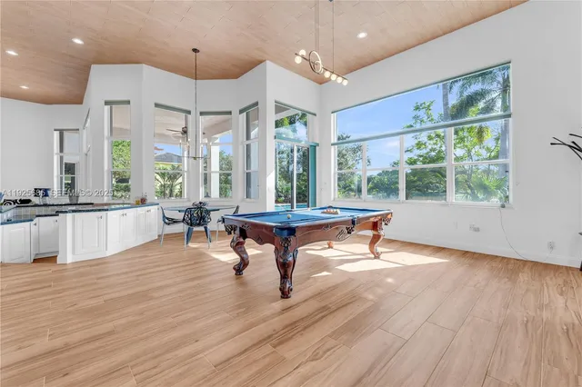 a view of a swimming pool with a patio