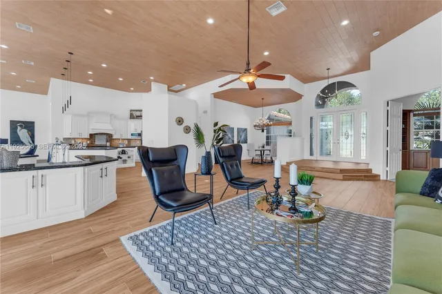 a view of a livingroom with furniture and a chandelier