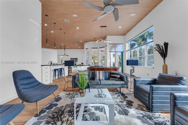 an aerial view of a house with a yard and trees