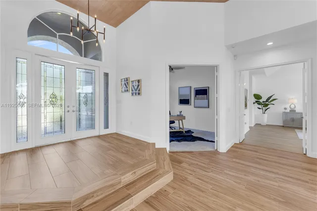 a living room with furniture and a ceiling fan