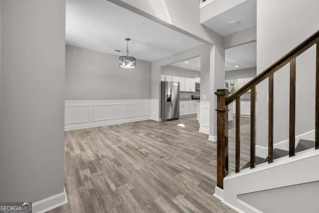 a view of entryway with stairs and wooden floor