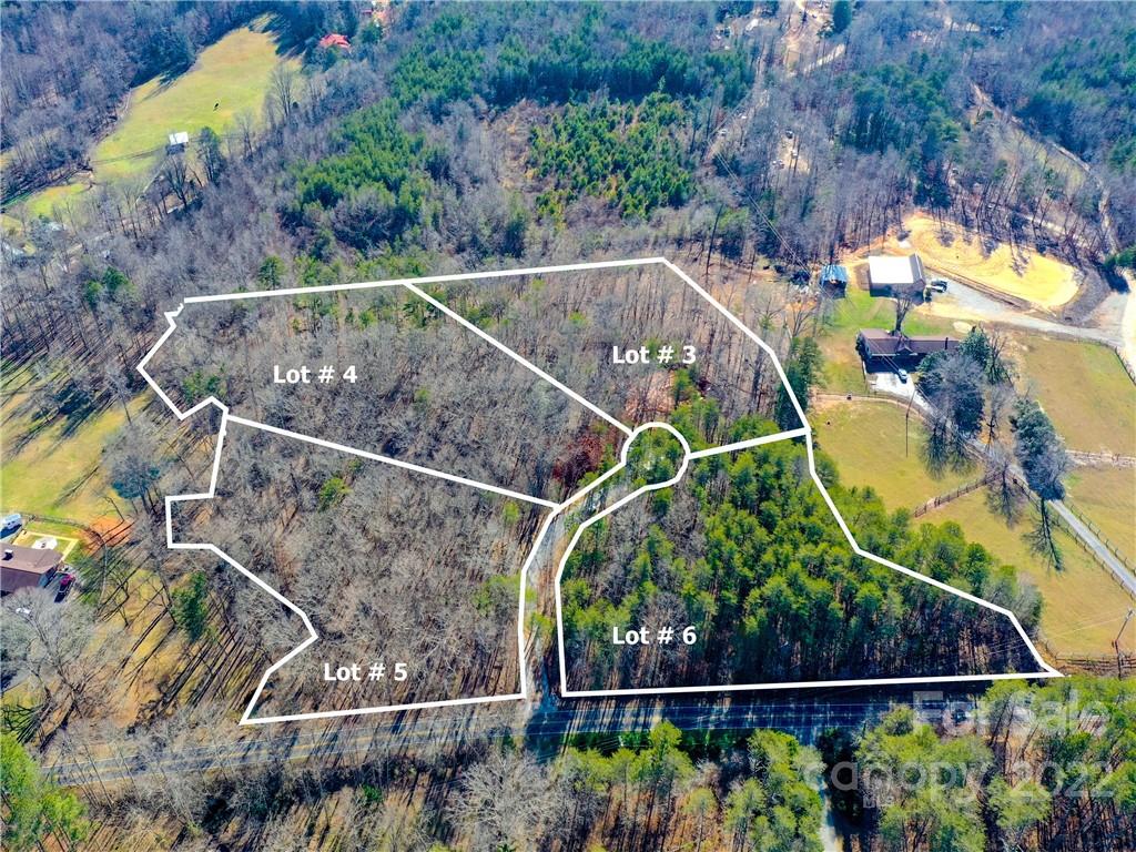 5 Riva Ridge Lane Columbus, NC 28722 - Photo 2 of 12 a view of a swimming pool with a garden