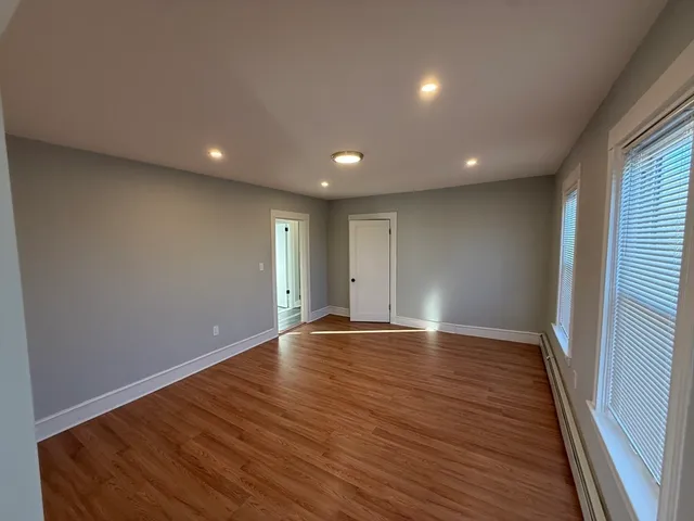 a view of room with hardwood floor