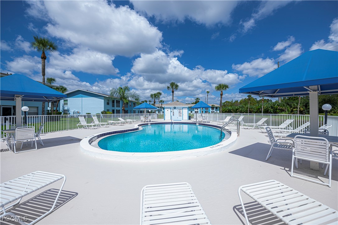 a view of a swimming pool with a patio