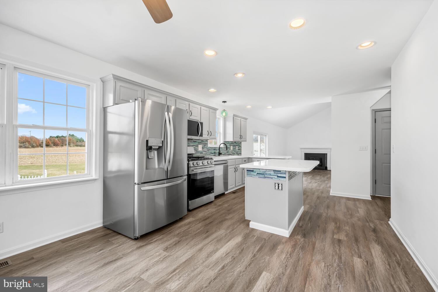 119 Wye Knot Road Queenstown, MD 21658 - Photo 18 of 45 a kitchen with stainless steel appliances a refrigerator sink and microwave