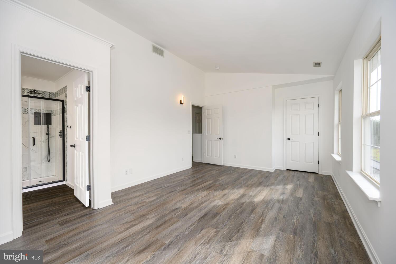 119 Wye Knot Road Queenstown, MD 21658 - Photo 29 of 45 a view of an empty room with wooden floor and a window