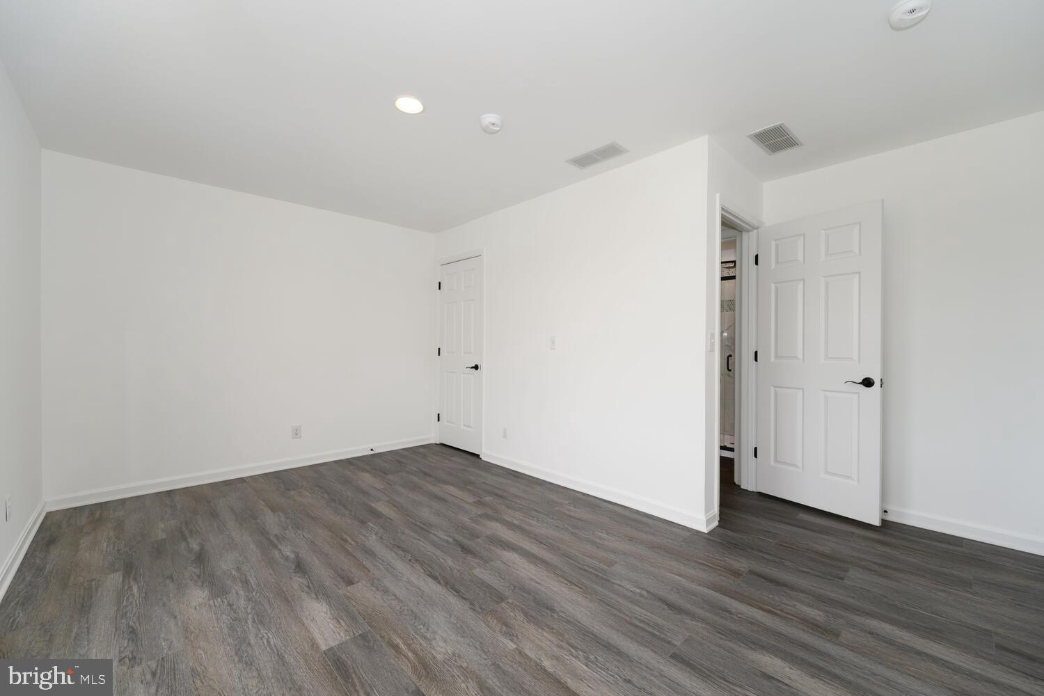 119 Wye Knot Road Queenstown, MD 21658 - Photo 34 of 45 a view of an empty room with wooden floor