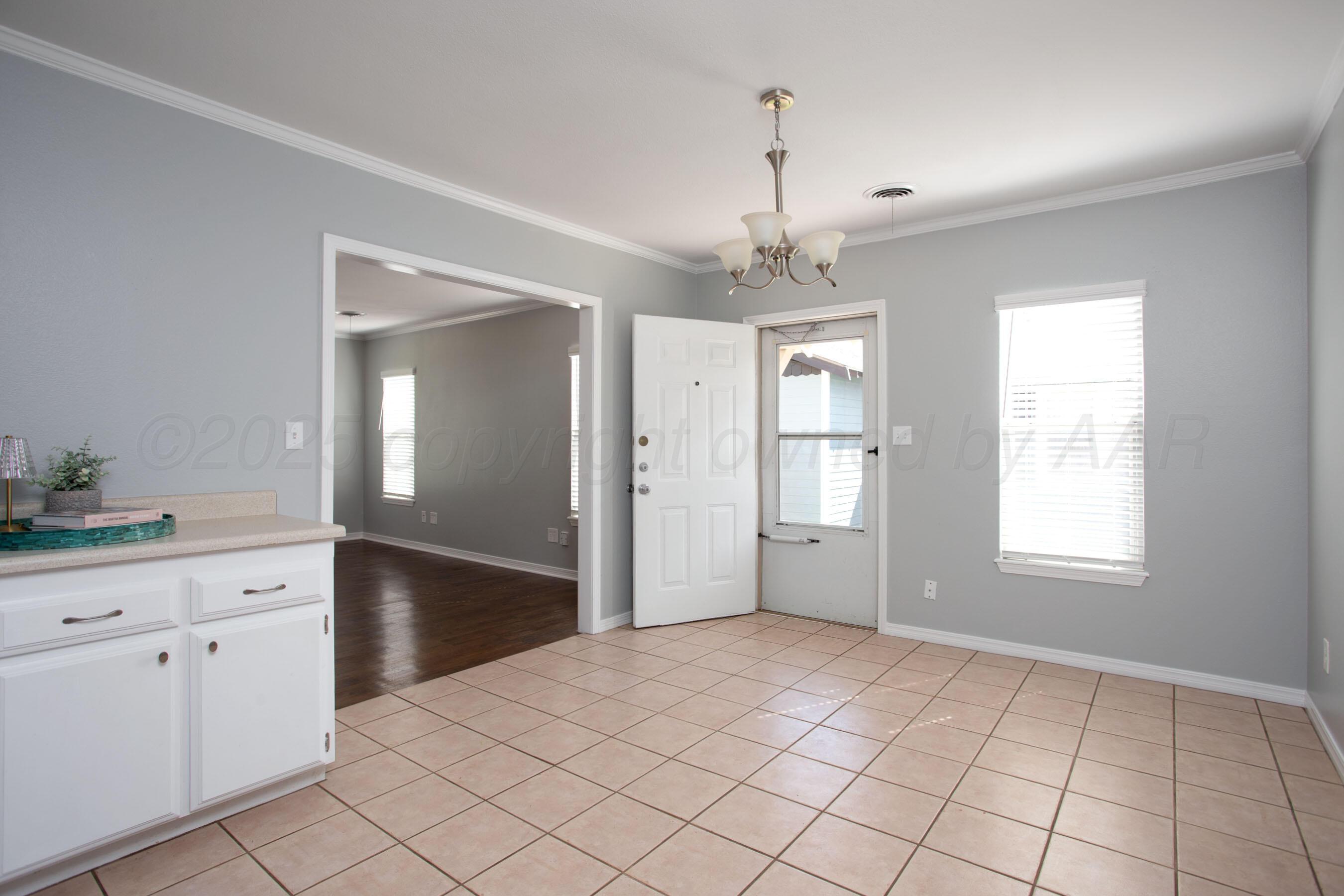 406 Sunset Terrace Amarillo, TX 79106 - Photo 15 of 25 a view of an empty room with window and cabinet