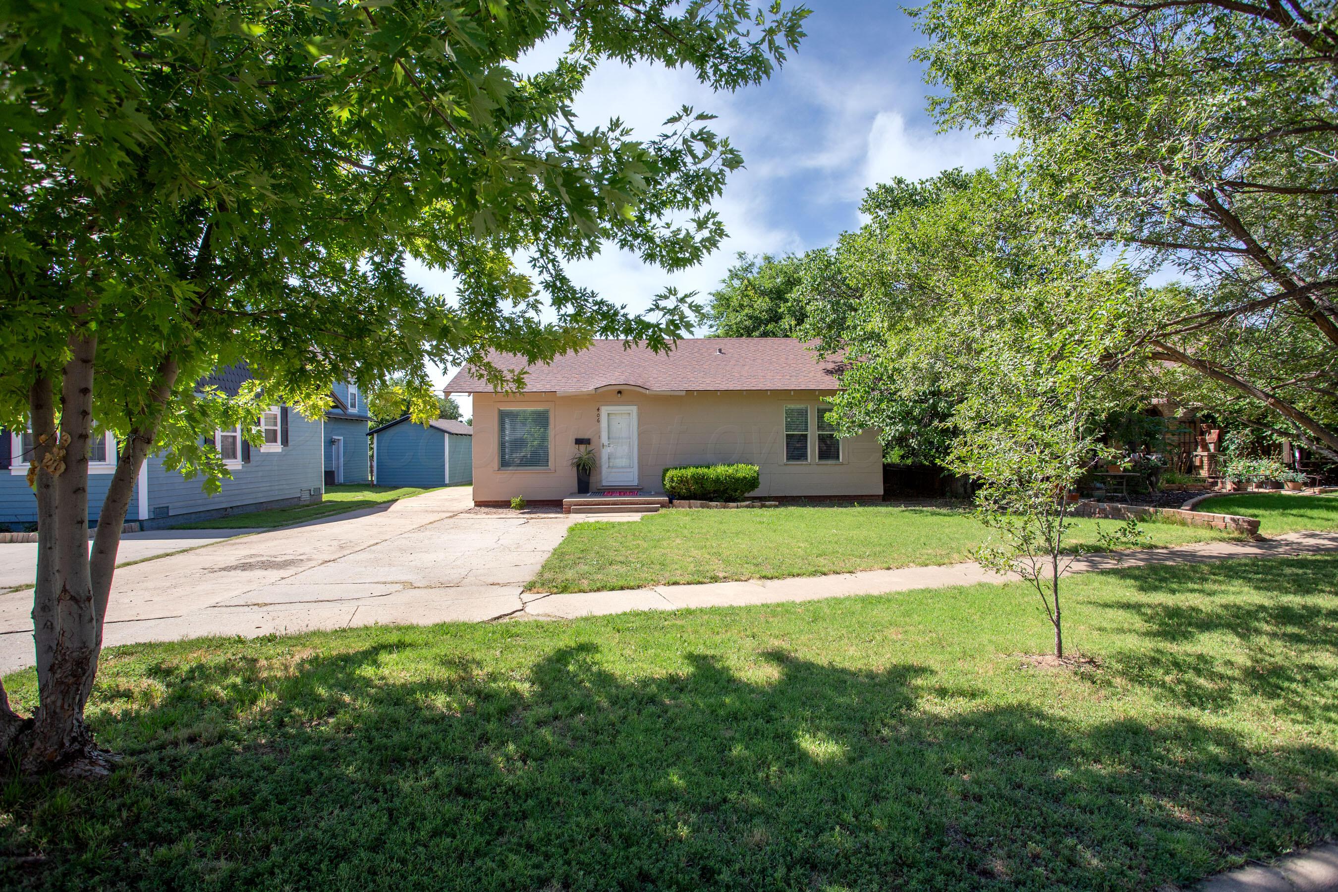 406 Sunset Terrace Amarillo, TX 79106 - Photo 2 of 25 a view of a house with a yard and tree
