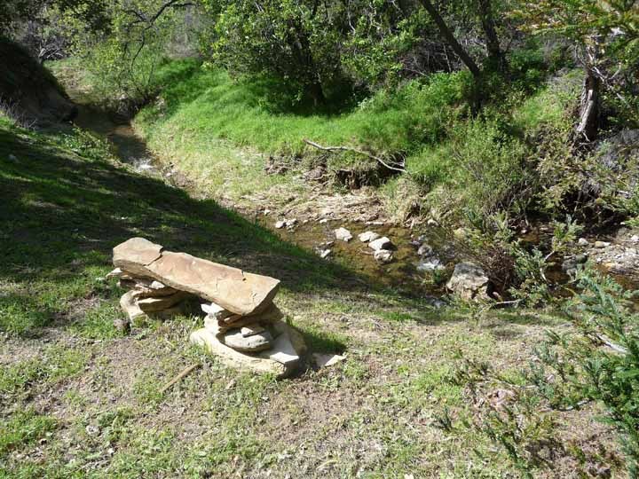 87 Hollister Ranch Road Goleta, CA 93117 - Photo 14 of 19 Main Barn stone bench at Sta Anita Creek