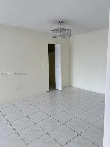 a view of a room with sliding glass door