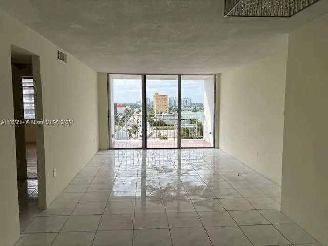 a kitchen with stainless steel appliances granite countertop white refrigerator stove a sink and dishwasher