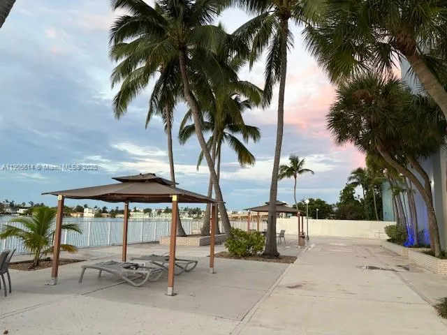 a view of swimming pool with chairs