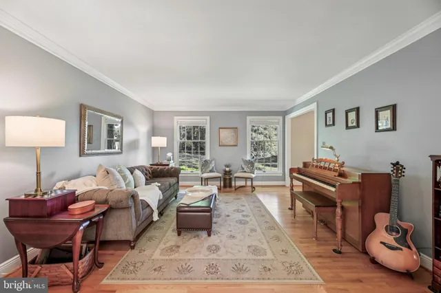 a living room with a fireplace and a fireplace