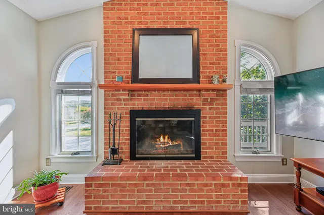 a kitchen with white cabinets and sink