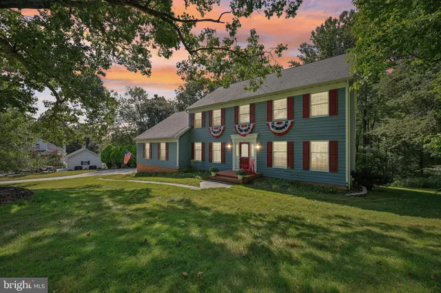 a living room with furniture a window and a flat screen tv