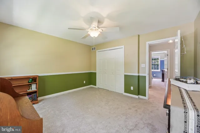 a spacious bathroom with a granite countertop sink a mirror and a shower