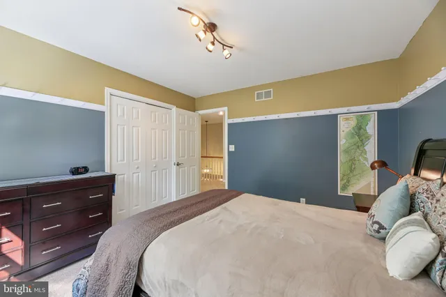 a view of a house with a yard table and chairs