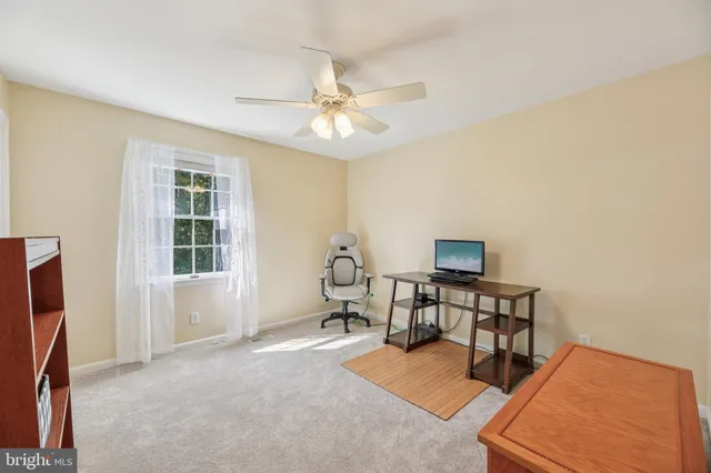 a view of a patio with a table and chairs