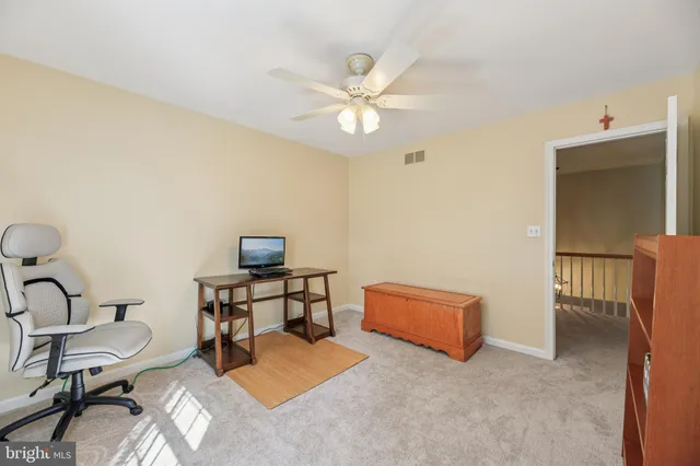 a view of a two chairs and table in the balcony