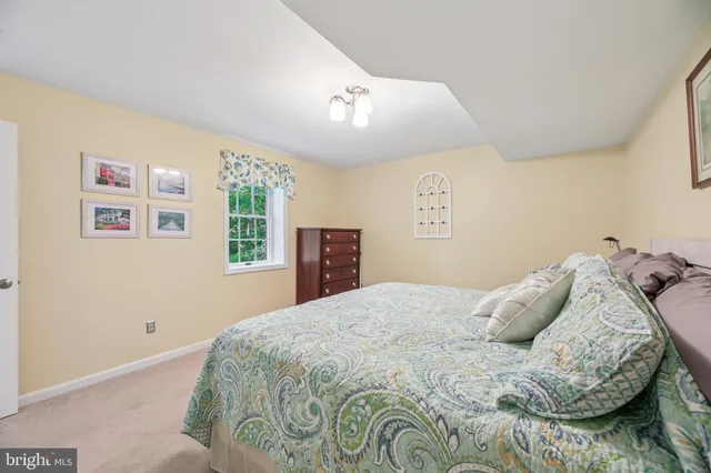 a view of house with a yard from a balcony