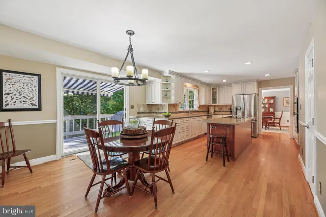 a view of an entryway with wooden floor and windows