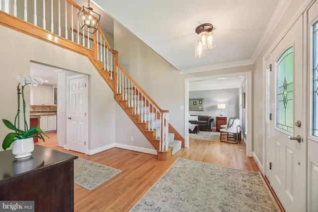 a living room with furniture a rug and a lamp