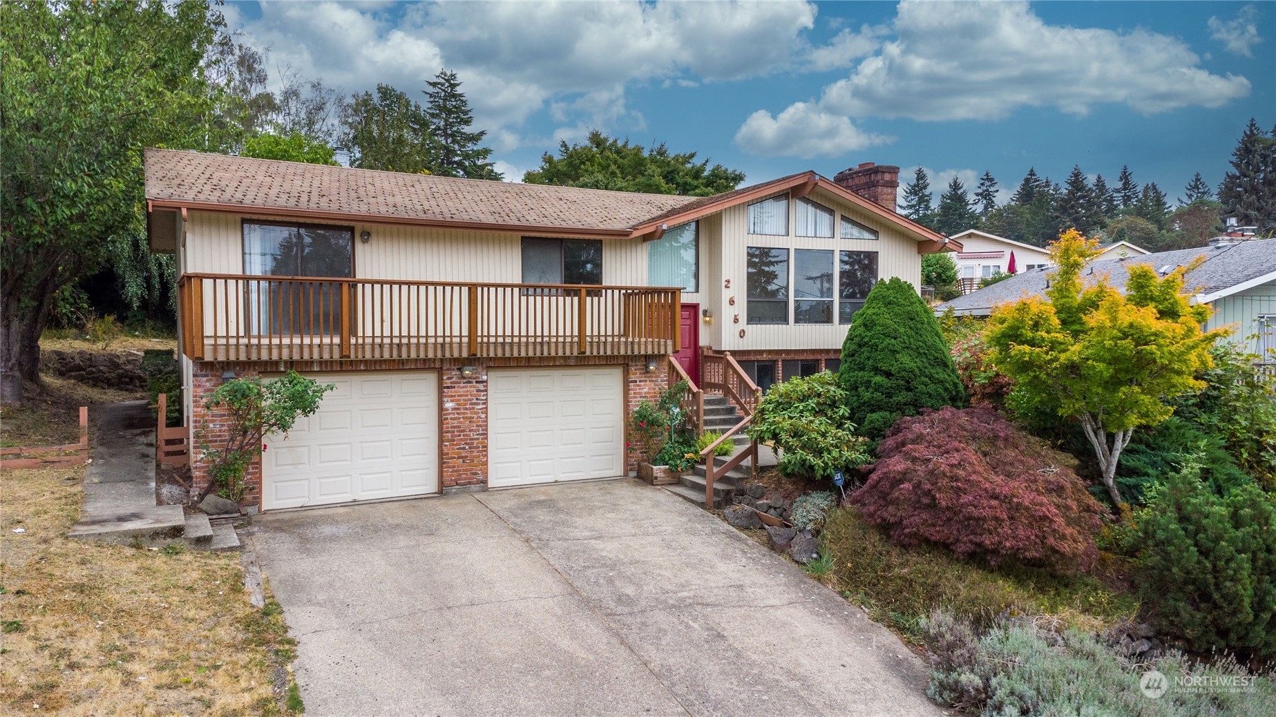 2650 Cherry Avenue Bremerton, WA 98310 - Photo 1 of 25 a view of a house with roof and plants