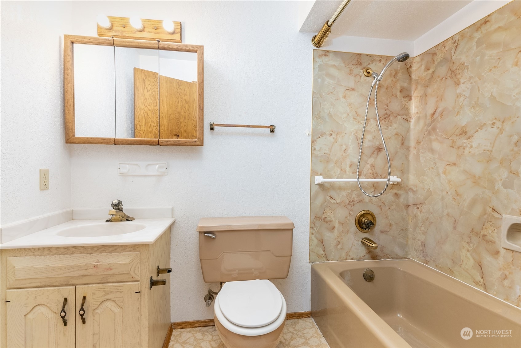 2650 Cherry Avenue Bremerton, WA 98310 - Photo 18 of 25 a bathroom with a sink a toilet and a bathtub
