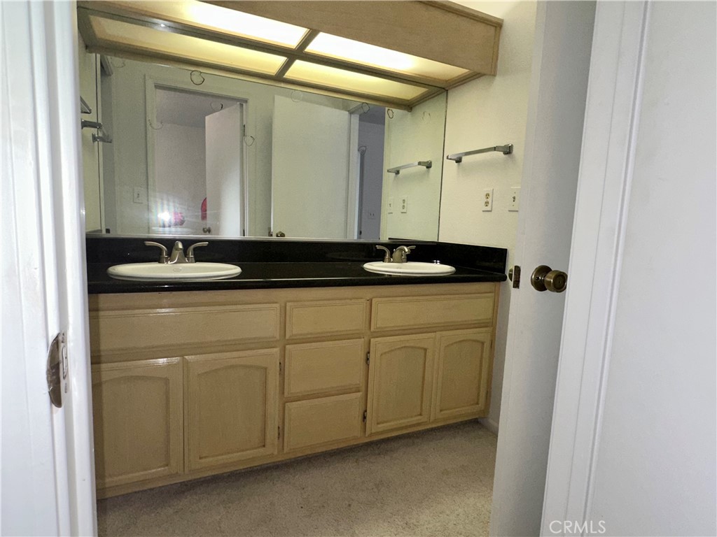 3072 Ironwood Court Merced, CA 95340 - Photo 12 of 25 a bathroom with a granite countertop sink and a mirror