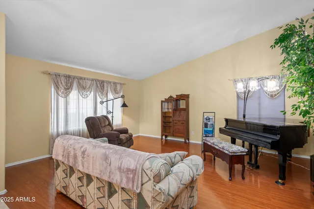 a view of a room with window and wooden floor
