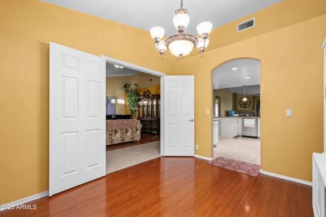 a spacious bedroom with a bed and a table