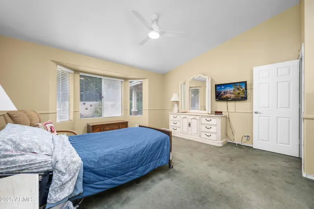 a bedroom with a bed and a cabinets