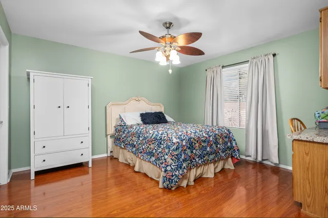 a bedroom with bed and window
