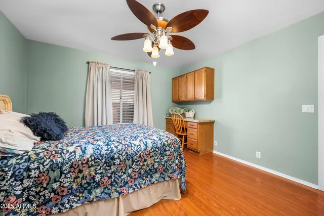 a bedroom with a bed and a dresser