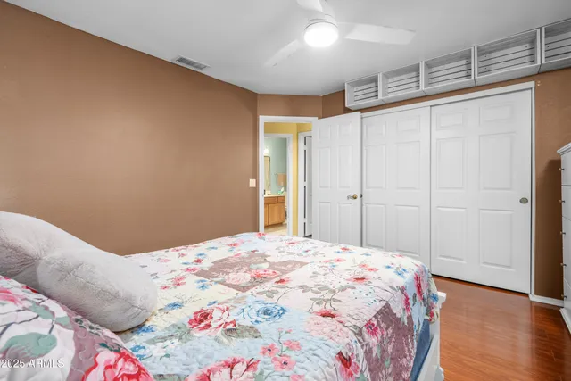 a bathroom with a double vanity sink toilet mirror and shower