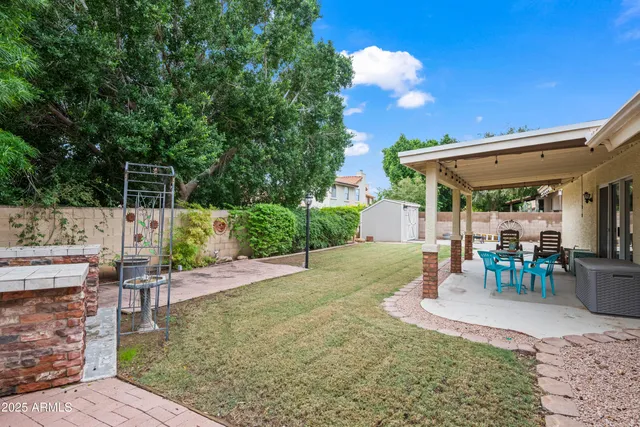 a view of a backyard with sitting area