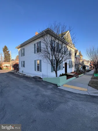 a view of a house with a street