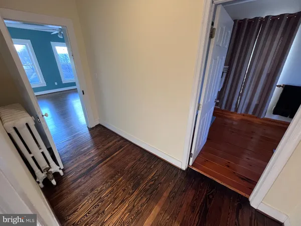 a view of staircase and wooden floor