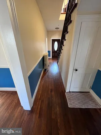 a view of entryway with wooden floor