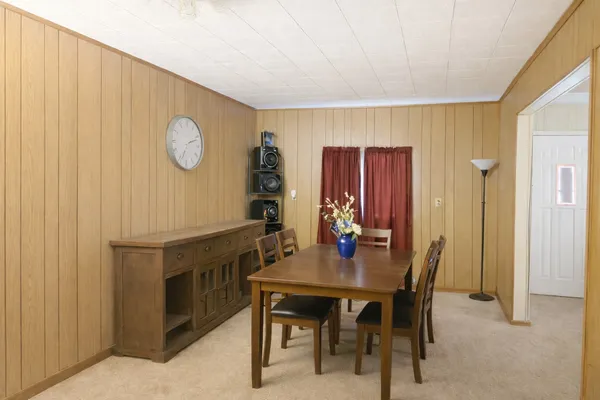 a view of a dining room with furniture
