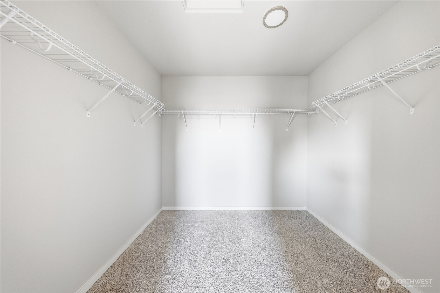 1066 Southwest 99th Place, Unit 55 Seattle, WA 98106 - Photo 16 of 21 a view of a room with racks on the wall