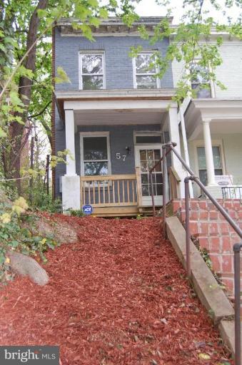 57 Todd Place Northeast Washington, DC 20002 - Photo 2 of 15 a front view of a house with a garden